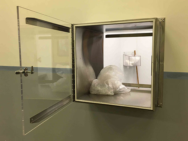 All molded products packaged in double plastic bags in White Room and then packaged in cardboard boxes in a designated room with product transferred from White Room through a passthru door.